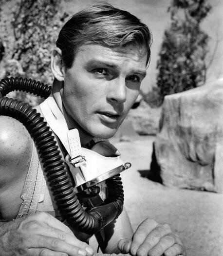 Adam West getting ready to explore an underwater cave, ca. 1961