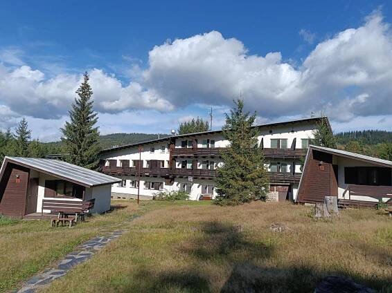 a large building in the middle of a field at Hotel Bečva na Horní Bečvě in Horní Bečva