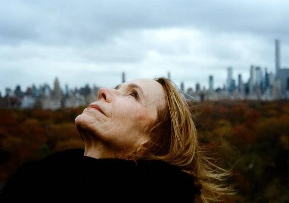 Harper, on that same balcony, throws her head back and looks at the sky.
