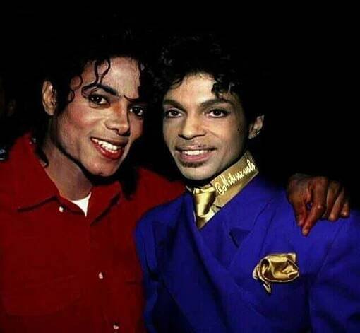two men dressed in costumes posing for a photo