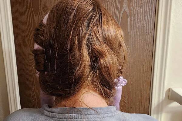 Close up of the Mermade Hair Heatless Curls Kit in a person's hair