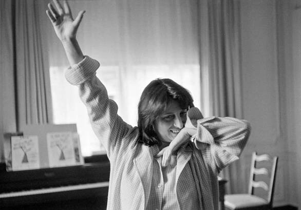 Anna Magnani Smiles As She Stretches In Her Pajamas, Rome, 1953.