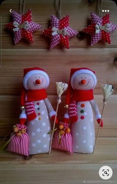 two snowmen are standing next to each other