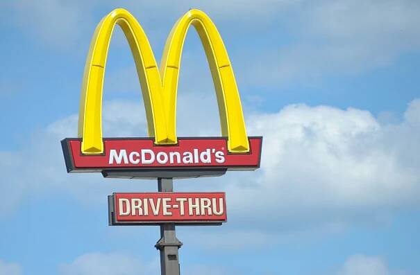 McDonald's sign with drive-thru indicator.