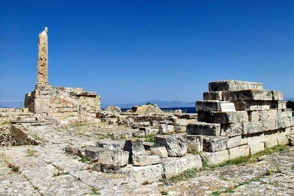 a stone building with a monument on top of it