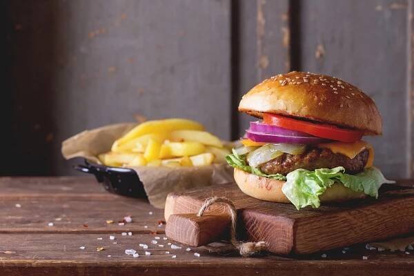 Burger and potatoes royalty free stock photography