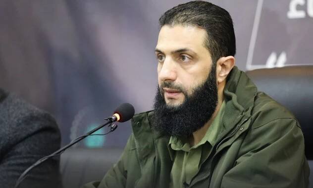 The General Commander of Hayat Tahrir al-Sham Abu Mohammad al-Jolani during a conference launching a support campaign for the camps in northern Syria - December 15, 2022 (Amjad Media Foundation)