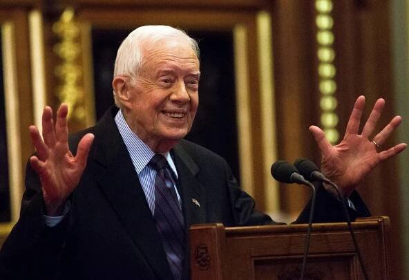 Former U.S. President Jimmy Carter delivers a lecture on the eradication of the Guinea worm, at the House of Lords in London