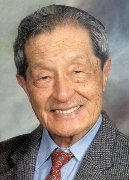 Color photo of a man in a suit