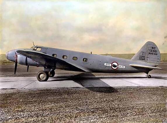 A silver single propeller plane about to take off from an airstrip. The plane has four passenger windows, and a narrow nose. 