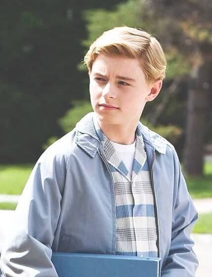 a young man holding a blue folder in his hands