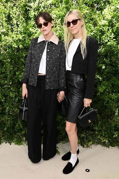 Kristen Stewart, wearing CHANEL, and Dylan Meyer attend the Academy Women's Luncheon Presented By CHANEL 