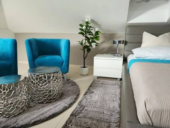 Postel nebo postele na pokoji v ubytování Wellness Apartmány EMPORIO