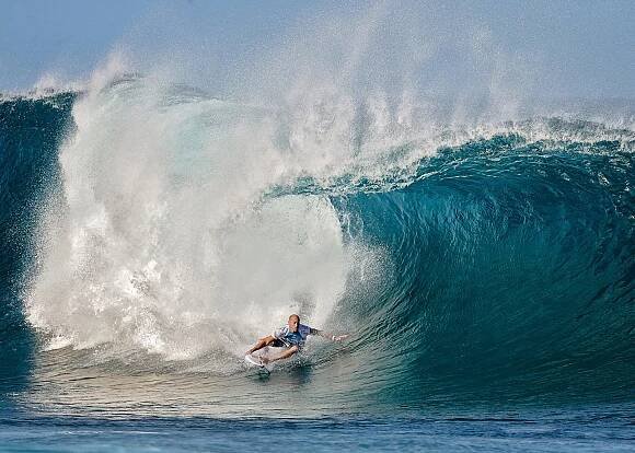 Man on surfboard on big wave