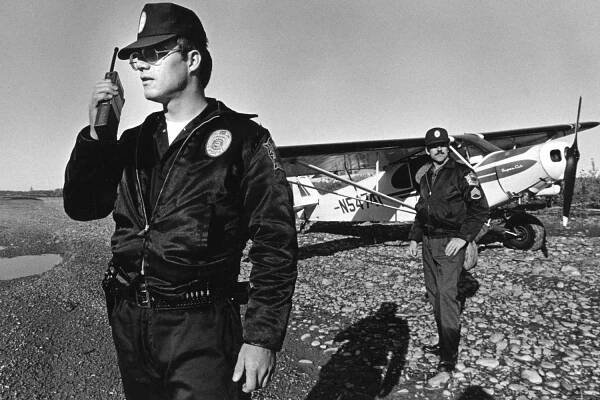 Alaska State Troopers conduct the search of the Knik Flats for bodies of missing women on September 17, 1983.