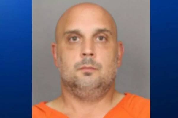 43-year-old Sean M. Higgins has been charged with two counts of death by auto