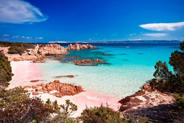 Pink beach and turquoise water in Sardinia, Italy.