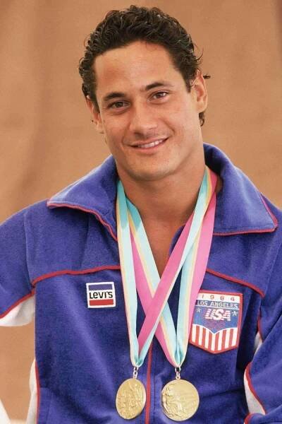 USA's Greg Louganis poses with his two gold medals during the Summer Olympics XXIII in 1984 