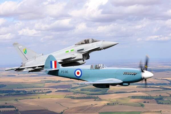 RAF Typhoon flying in formation with a Spitfire.