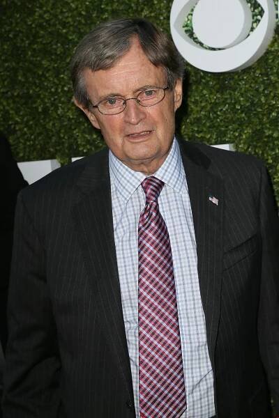 Portrait of a man in a suit and tie.