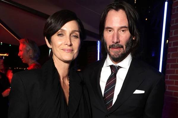 Keanu Reeves and Carrie-Anne Moss Would Love to Team Up in a John Wick Movie: 'Let's Get on That'
