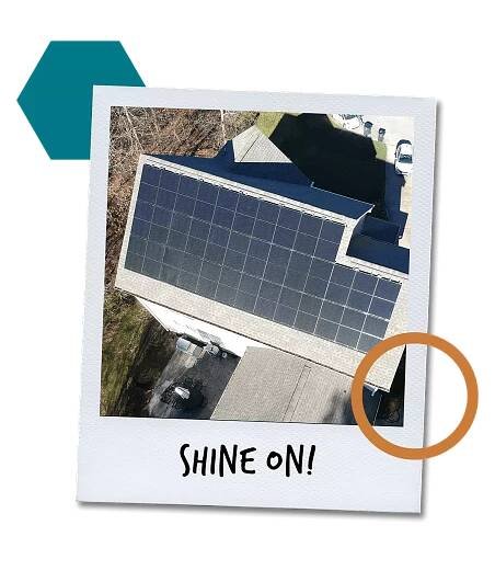 Polaroid with a aerial picture of a home with a roof top solar system