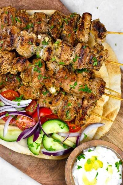 Another picture of the pork souvlaki on pita bread with veggies.