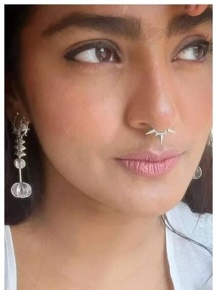 Parvathy Thiruvothu charms in white