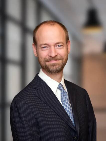 A headshot of Michael Manschot, Managing Director and Portfolio Manager at Commons Capital in New York City.