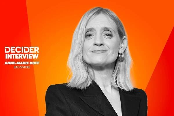 ANNE MARIE DUFF in black and white on a bright orange background