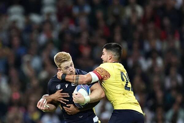 Scotland's right-wing Kyle Steyn (L) is tackled by Romania's fly-half Tudor Boldor (R) during the France 2023 Rugby World Cup Pool B match between Scotland and Romania at Pierre-Mauroy stadium in Villeneuve-d'Ascq near Lille, northern France, on September 30, 2023.