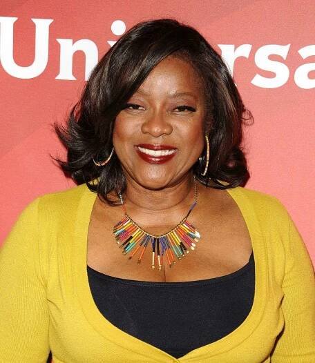 Loretta Devine lob with side-swept bangs and flipped-out ends
