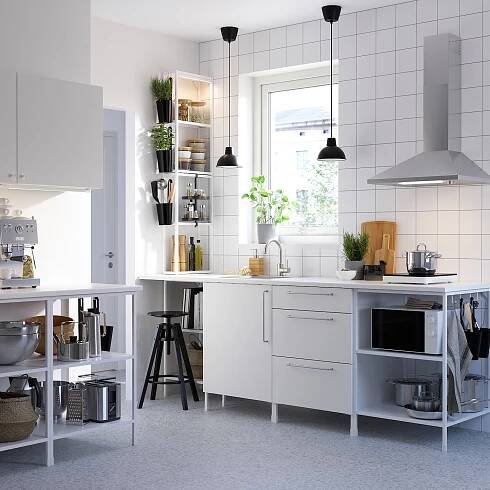 Modern white kitchen with ENHET series: base units with shelves, wall cabinets, countertop appliances, and hanging pendant lights.