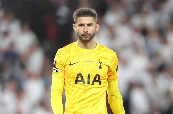 Guglielmo Vicario, Tottenham Hotspur goalkeeper, in yellow uniform.