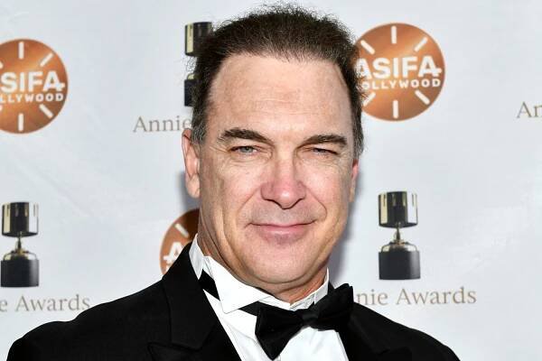 Patrick Warburton attends a 2019 red carpet event in a tuxedo