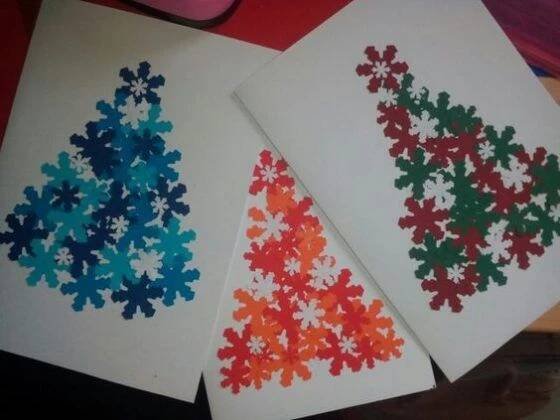 three cards with different colored snowflakes on them