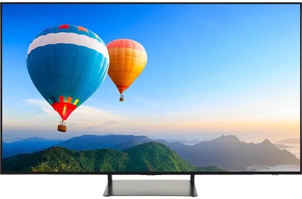 Samsung QE55S90C 4K TV showing image of hot air balloons above a mountain