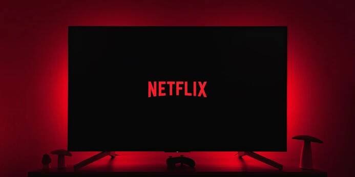 Netflix games TV | Netflix logo on TV in darkened room