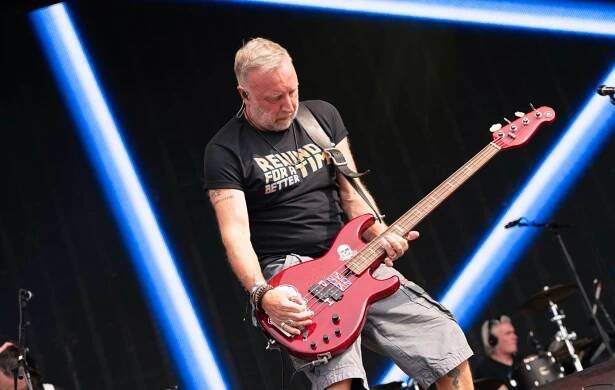Peter Hook performing live on stage
