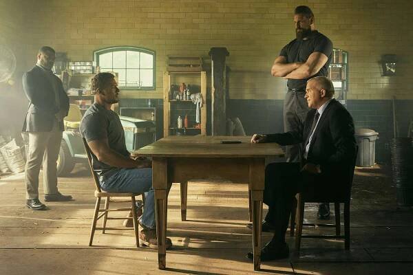 Donald Sales, Alan Ritchson (Jack Reacher), Olivier Richters (Paulie), and Anthony Michael Hall (Zachary Beck) in Reacher Season 3