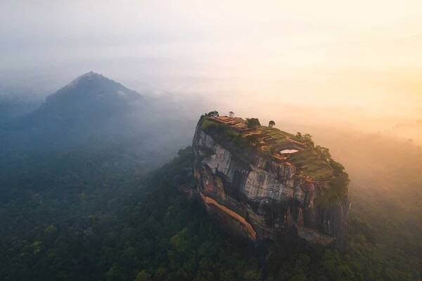 drone view of Sigiriya rock at sunrise with Pidurangala rock in the background
