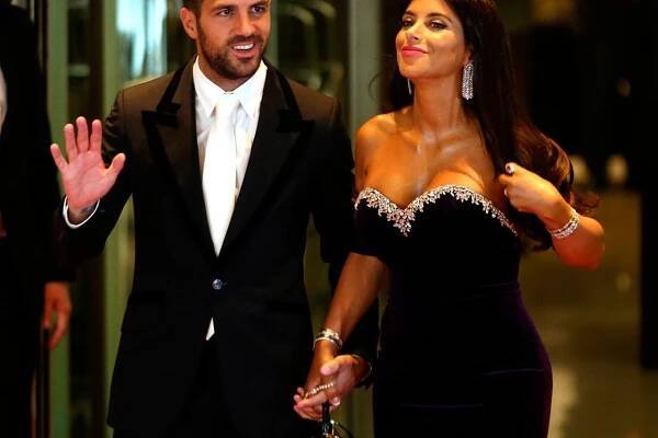 Argentine soccer player Lionel Messi's former Barcelona FC teammate Cesc Fabregas and his wife Daniella Semaan pose for photographers as they arrive to the wedding of Messi and Antonela Roccuzzo in Rosario, Argentina, June 30, 2017. REUTERS/Marcos Brindicci