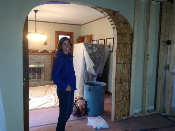 Mary enjoys the construction progress. The archway was made slightly smaller to allow for a TV wall in the new sitting room.