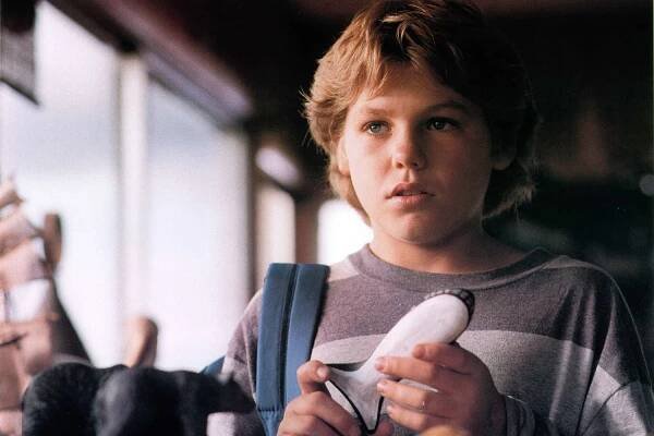 Jason James Richter holding whale piece in a scene from the film 'Free Willy', 1993.
