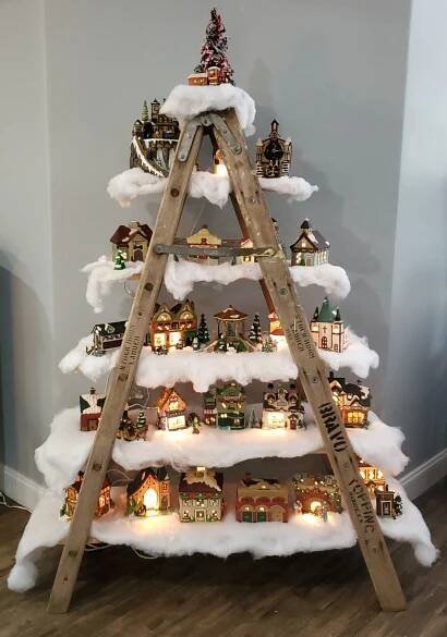 a christmas tree made out of wooden ladders