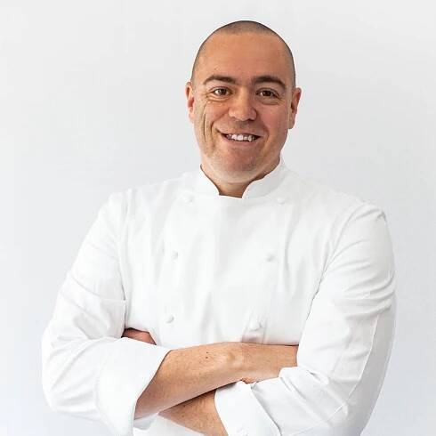 Chef Matt Abé with arms crossed.