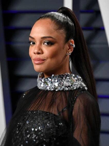 Tessa Thompson with a sleek high ponytail 