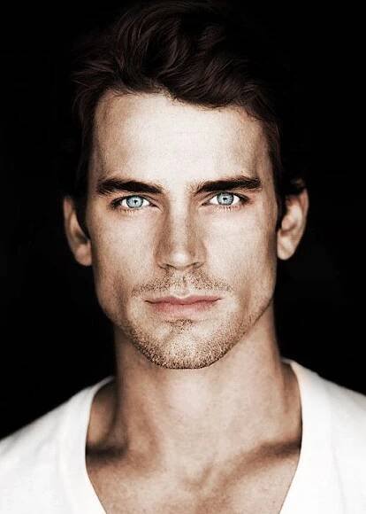 a man with blue eyes looking at the camera