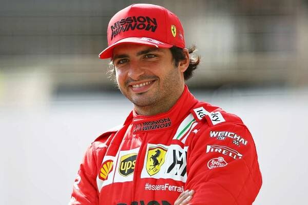 Carlos Sainz of Spain and Ferrari looks on from the grid during Day One of F1 Testing at Bahrain International Circuit on March 12, 2021 in Bahrain, Bahrain.