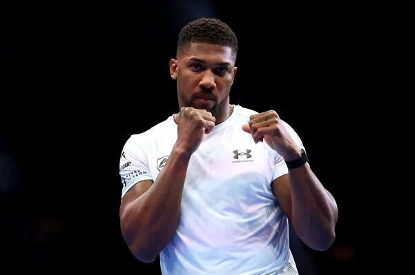 Anthony Joshua training in a white shirt.